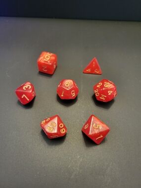 Silky Swirl Red Polyhedral RPG Dice Set with Gold Numbers - Home Games